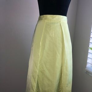 Pleated bright yellow skirt